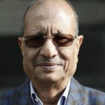 Conceptual image of corporate investigation in Nepal, featuring a silhouetted businessman in a suit against a backdrop of financial charts and a subtle steel factory structure.